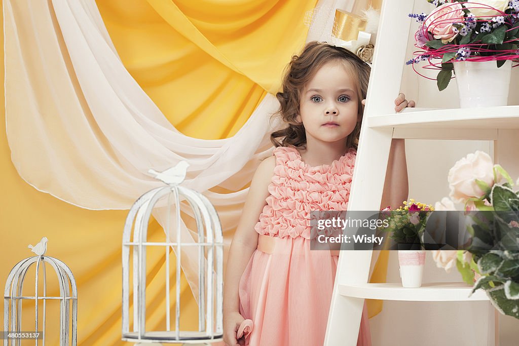 Portrait of lovely girl posing in vintage interior