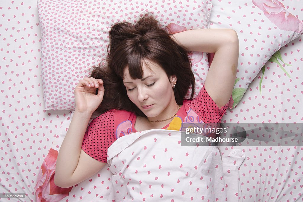 Girl of twenty-five years sleeping in bed