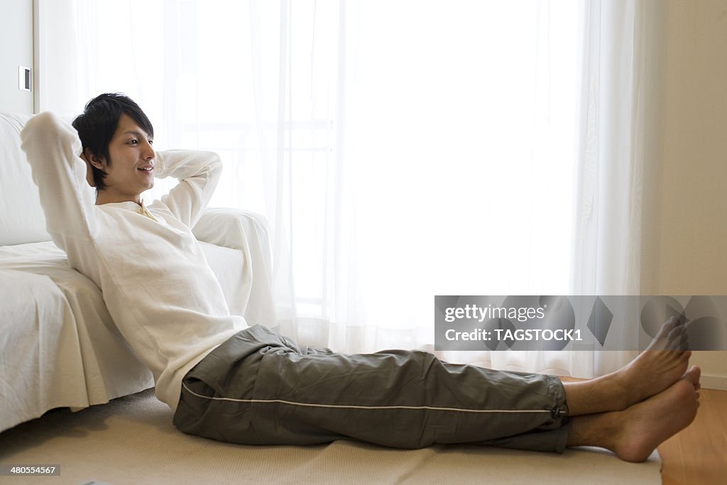 Man sitting on floor and relaxed