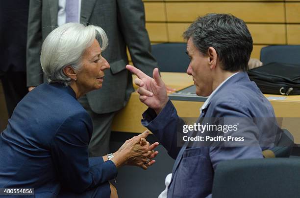 Greek Finance Minister Euclid Tsakalotos speaks with Managing Director of the International Monetary Fund Christine Lagarde during the meeting of...