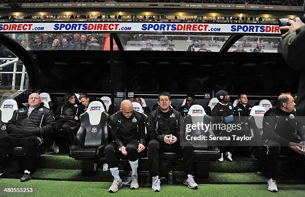 Newcastle's Assistant Manager John Carver sits in the dugout with First Team Coach Steve Stone during the Barclays Premier League match between...