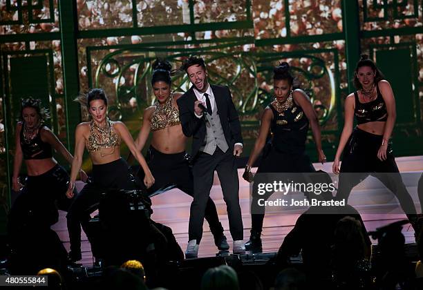 Travis Garland performs onstage with Miss USA contestants at 2015 Miss USA Pageant Only On ReelzChannel at The Baton Rouge River Center on July 12,...