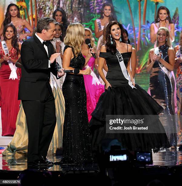 Hosts Todd Newton and Former Miss Wisconsin Alex Wehrley speak with Most Photogenic winner Miss Indiana Gretchen Reece onstage at the 2015 Miss USA...