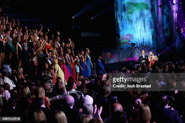 Hosts Todd Newton and Former Miss Wisconsin Alex Wehrley speak onstage at the 2015 Miss USA Pageant Only On ReelzChannel at The Baton Rouge River...