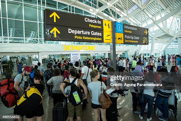 Foreign tourists arrive at Ngurah Rai International airport departure on July 13, 2015 in Denpasar, Bali, Indonesia. Bali's international airport...