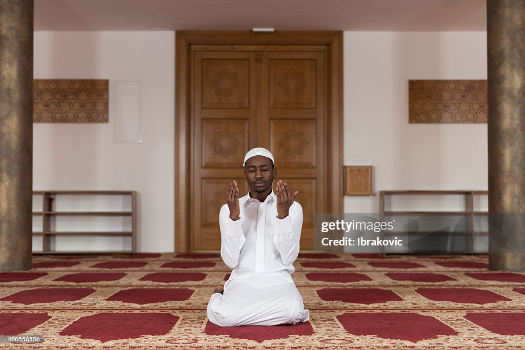 African Muslim Man Is Praying In The Mosque