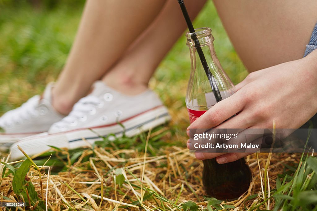 Cola in girl's hand