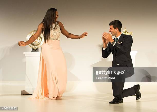 Serena Williams of the United States and Novak Djokovic of Serbia dance on stage at the Champions Dinner at the Guild Hall on day thirteen of the...