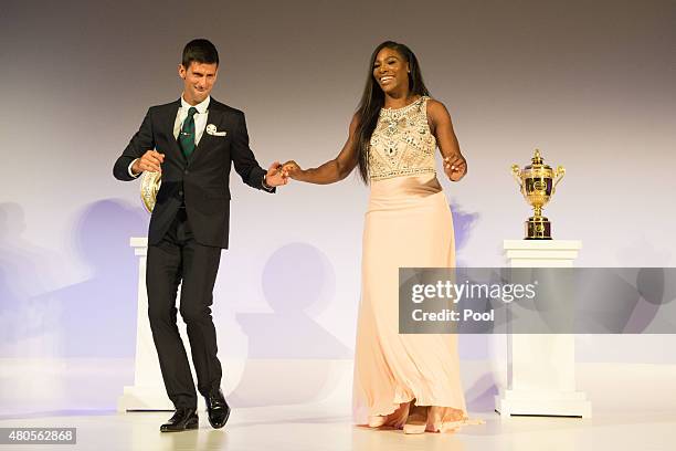 Serena Williams of the United States and Novak Djokovic of Serbia dance on stage at the Champions Dinner at the Guild Hall on day thirteen of the...