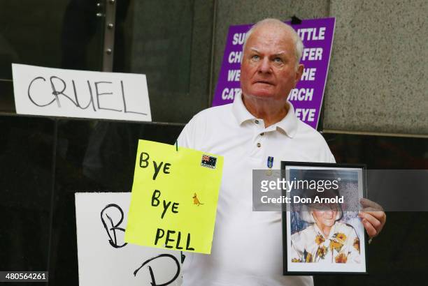 Abuse survivor John Hennessy protests outside Phillip Macquarie Tower on March 24, 2014 in Sydney, Australia. Cardinal Pell is facing the Royal...