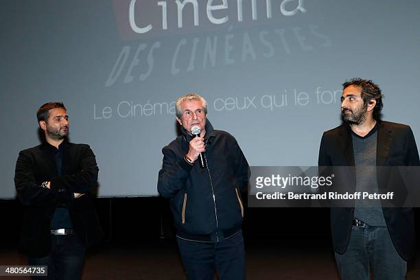 French director Claude Lelouch speaks on stage, framed by French directors Olivier Nakache and Eric Toledano, both of "Intouchables" fame, prior to...