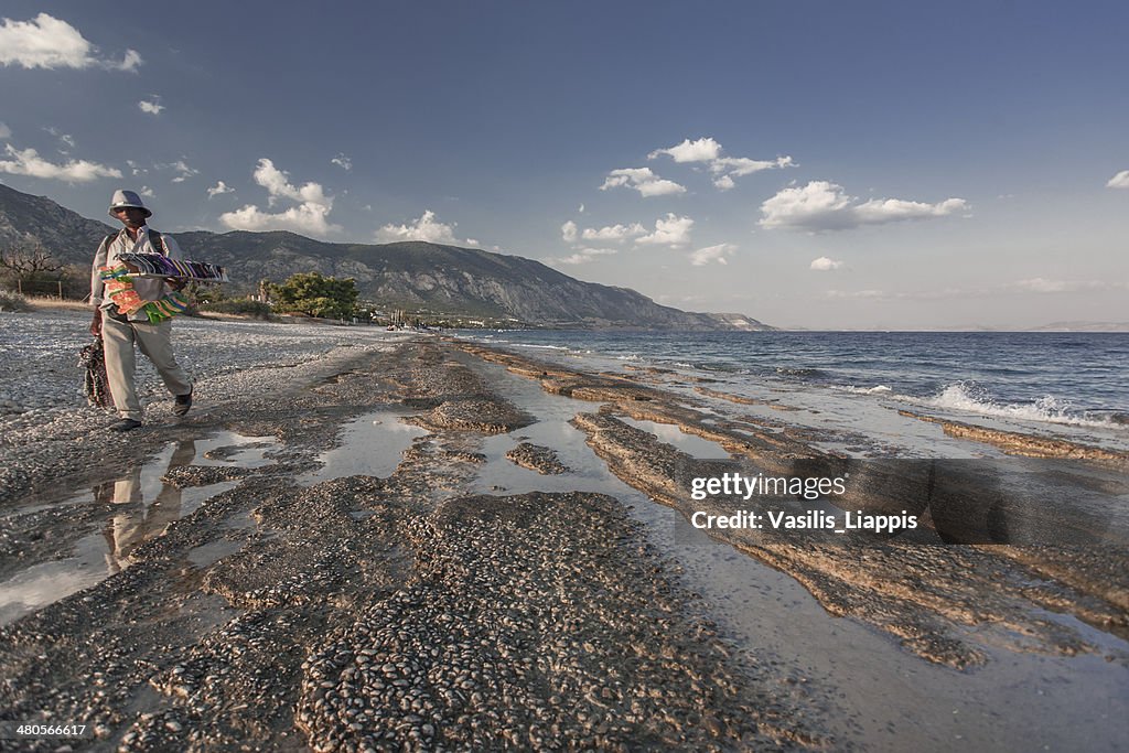 Itinerant merchant on a beach