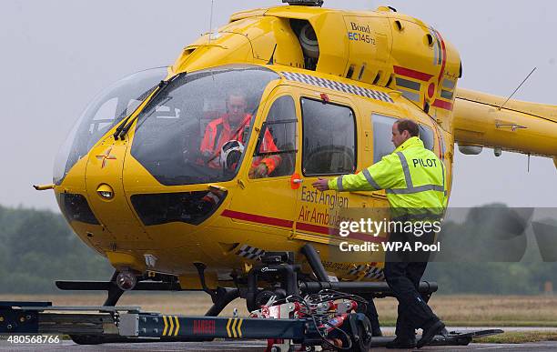 Prince William, The Duke of Cambridge as he begins his new job with the East Anglian Air Ambulance at Cambridge Airport on July 13, 2015 in...