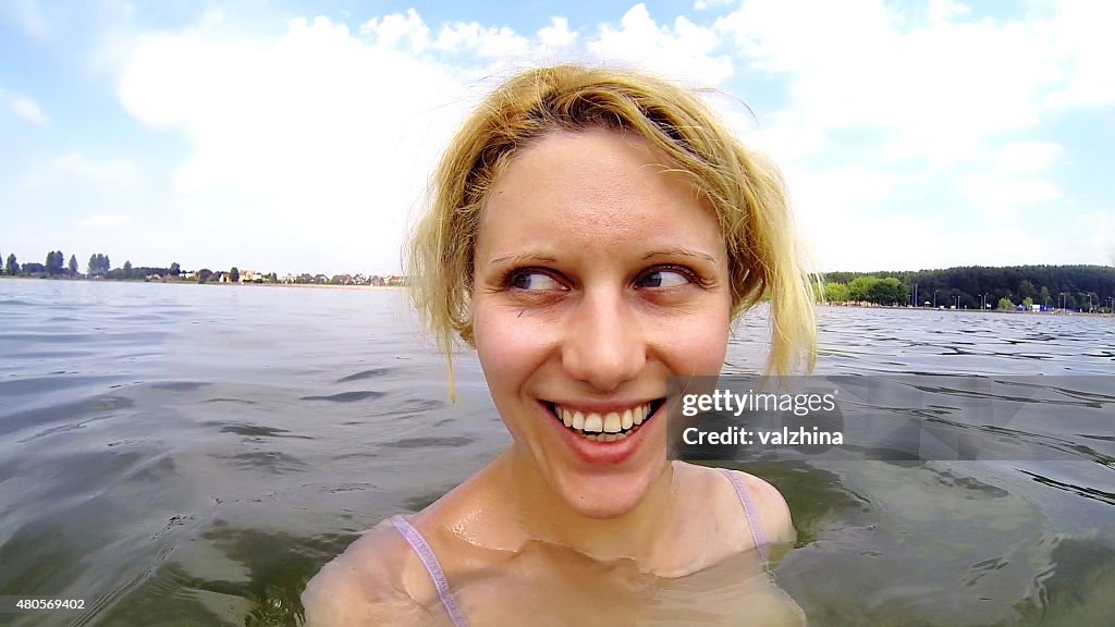 Woman swimming in a lake