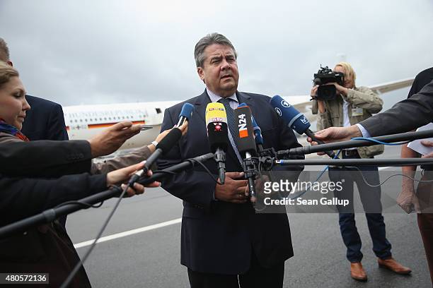 German Vice Chancellor and Economy and Energy Minister Sigmar Gabriel speaks to the media about the just-passed Greece aid package before boarding a...