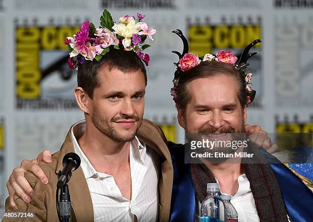 Actor Hugh Dancy and executive producer/creator Bryan Fuller wear flower crowns at the "Hannibal" Savor the Hunt panel during Comic-Con International...