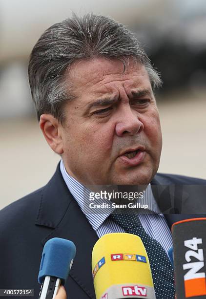 German Vice Chancellor and Economy and Energy Minister Sigmar Gabriel speaks to the media about the just-passed Greece aid package before boarding a...