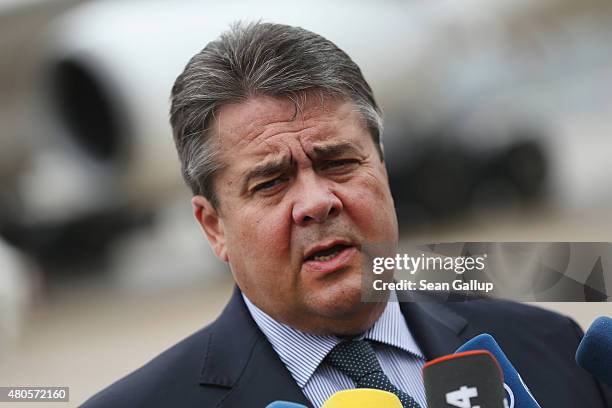 German Vice Chancellor and Economy and Energy Minister Sigmar Gabriel speaks to the media about the just-passed Greece aid package before boarding a...