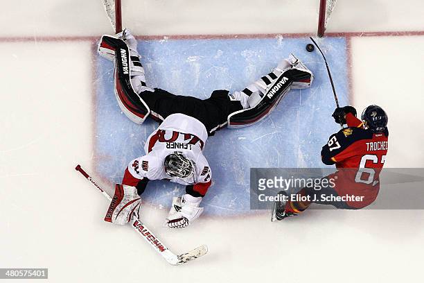 Vincent Trocheck of the Florida Panthers scores against goaltender Robin Lehner of the Ottawa Senators in a shoot out at the BB&T Center on March 25,...