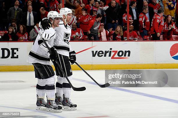 Anze Kopitar and Jeff Carter of the Los Angeles Kings celebrate after the Kings defeat the Washington Capitals 5-4 during an NHL game at Verizon...