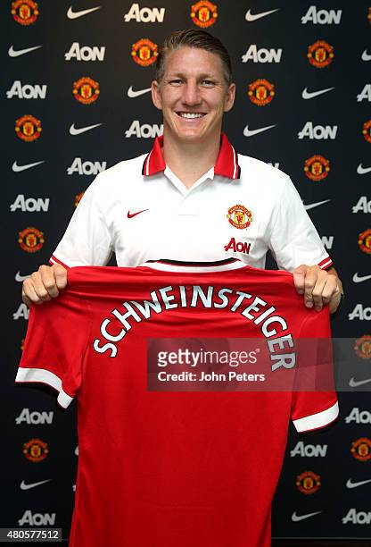 Bastian Schweinsteiger of Manchester United poses after signing for the club at Aon Training Complex on July 13, 2015 in Manchester, England.