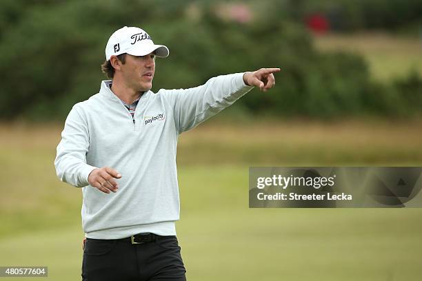 Brooks Kopeka of the United States signals from the fairway during practice ahead of the 144th Open Championship at The Old Course on July 13, 2015...