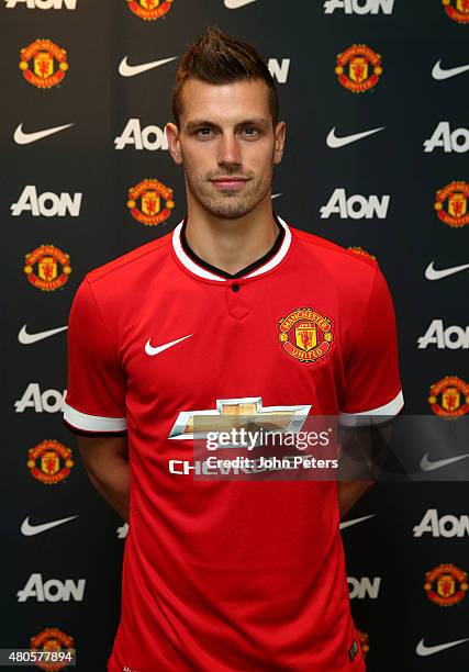 Morgan Schneiderlin of Manchester United poses after signing for the club at Aon Training Complex on July 13, 2015 in Manchester, England.