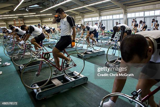 Keirin students train on rollers at the Nihon Keirin Gakkou on July 8, 2015 in Izu, Japan. Keirin is a form of cycle racing developed in Japan around...