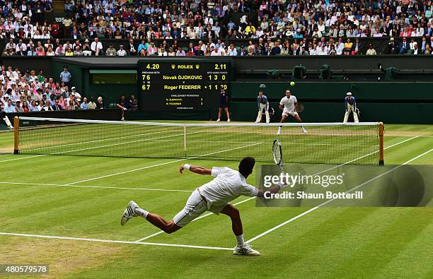 Novak Djokovic of Serbia plays a forehand in the Final Of The Gentlemen's Singles against Roger Federer of Switzerland on day thirteen of the...