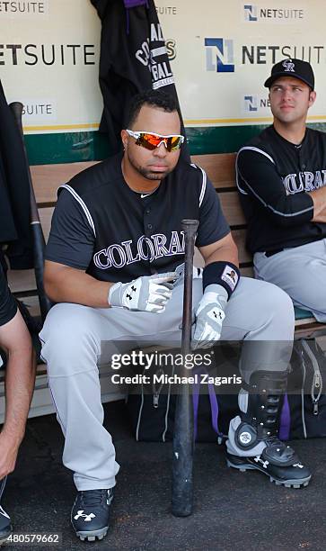 Wilin Rosario of the Colorado Rockies sits in the dugout prior to the game against the Oakland Athletics at O.co Coliseum on July 1, 2015 in Oakland,...