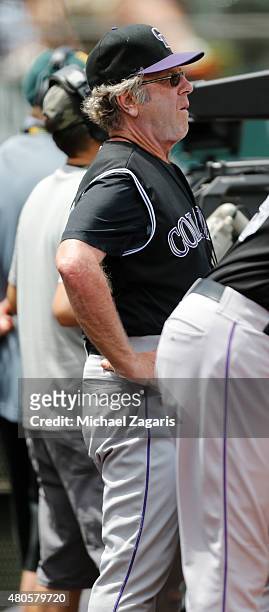Catching/Defensive Positioning Coach Rene Lachemann of the Colorado Rockies stands in the dugout during the game against the Oakland Athletics at...
