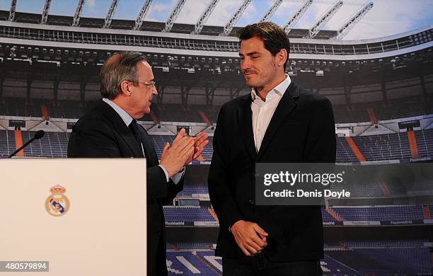 Real Madrid president Florentino Perez applauds Iker Casillas during a press conference to announce that Iker Casillas will be leaving Real Madrid on...