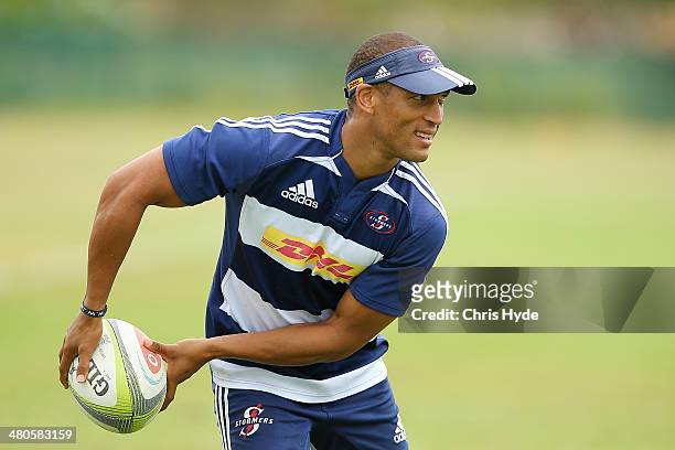 Gio Aplon passes during a Stormers Super Rugby training session at Sanctuary Cove on March 26, 2014 in Gold Coast, Australia.