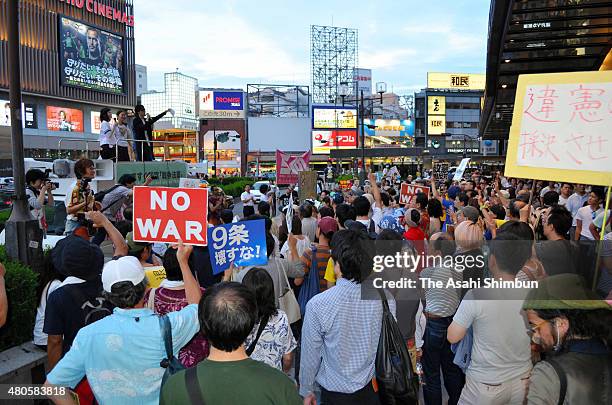 Anti-Security legislation protesters stage a rally on July 12, 2015 in Osaka, Japan. The ruling coalition has turned a deaf ear to the arguments made...