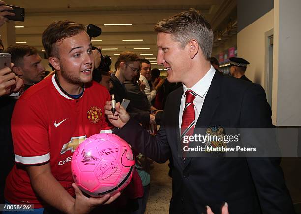 Bastian Schweinsteiger of Manchester United leaves for the club's pre-season tour of the USA at Manchester Airport on July 13, 2015 in Manchester,...