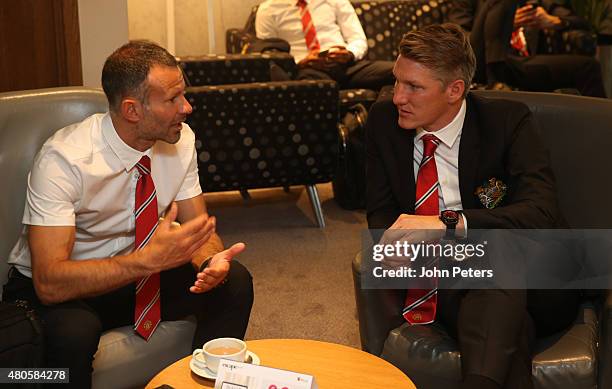 Assistant Manager Ryan Giggs and Bastian Schweinsteiger of Manchester United leave on the club's pre-season tour of the USA at Manchester Airport on...