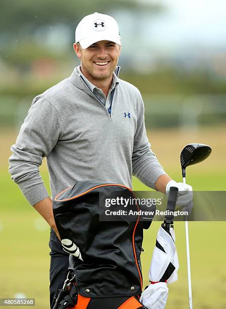 Jordan Spieth of the United States smiles before hitting on the driving range ahead of the 144th Open Championship at The Old Course on July 13, 2015...