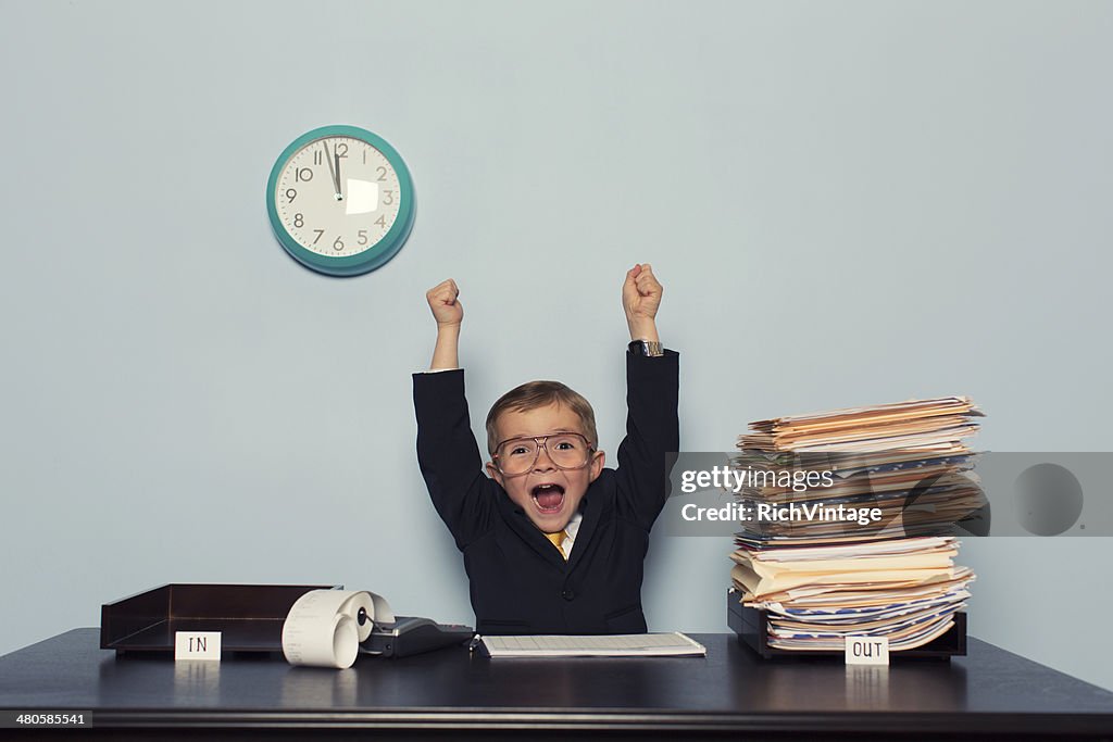 Young Business Boy Celebrates with Work Finished