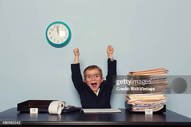 young business boy celebrates with work finished - excited children stock pictures, royalty-free photos & images