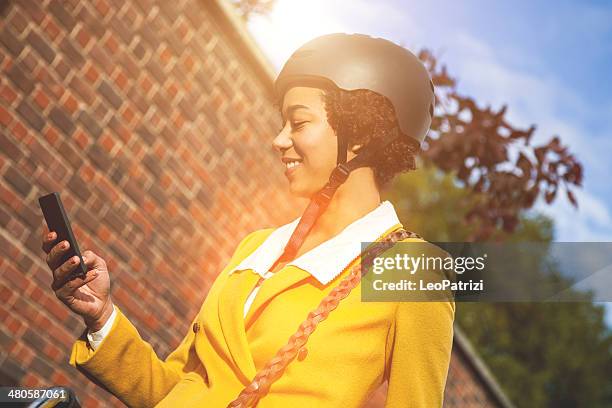 young woman going to work - cycling helmet stock pictures, royalty-free photos & images