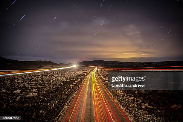 interstate highway at night - star trails stock pictures, royalty-free photos & images