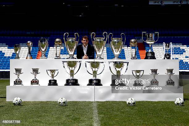 Iker Casillas poses with trophies he has won during his career in Real Madrid after holding a press conference to announce that he will be leaving...