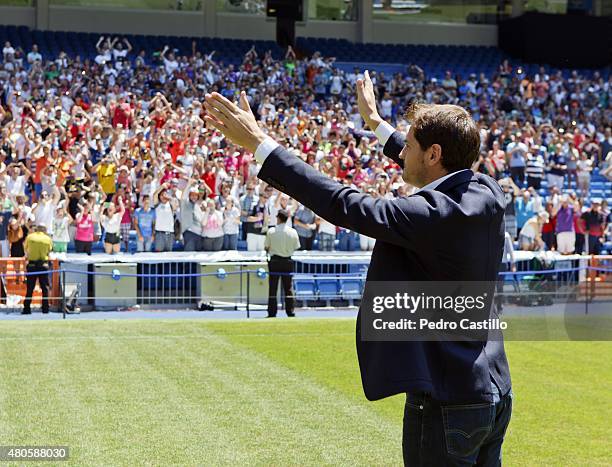 Iker Casillas waves to fans at the Santiago Bernabeu stadium after attending a press conference to announce that he will be leaving Real Madrid...