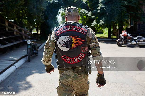 Member of the Luhansk chapter of the Night Wolves motorcyle club, who fight on the side of self-proclaimed Lugansk People's Republic, walks on the...