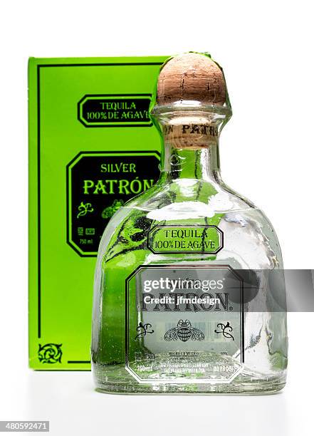 silver patron tequila bottle and box - lechuguilla cactus stock pictures, royalty-free photos & images