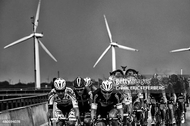 The pack rides during the 166 km second stage of the 102nd edition of the Tour de France cycling race on July 5 between Utrecht and Vrouwenpolder in...