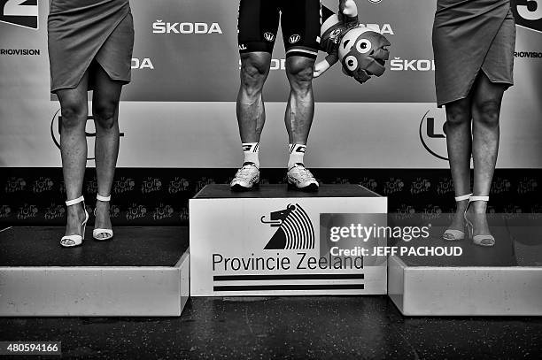 Stage winner Germany's Andre Greipel celebrates on the podium after winning the 166 km second stage of the 102nd edition of the Tour de France...