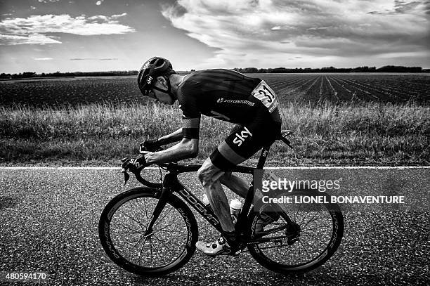 Great Britain's Christopher Froome rides in the pack during the 166 km second stage of the 102nd edition of the Tour de France cycling race on July 5...