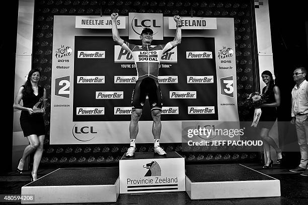 Stage winner Germany's Andre Greipel celebrates on the podium after winning the 166 km second stage of the 102nd edition of the Tour de France...
