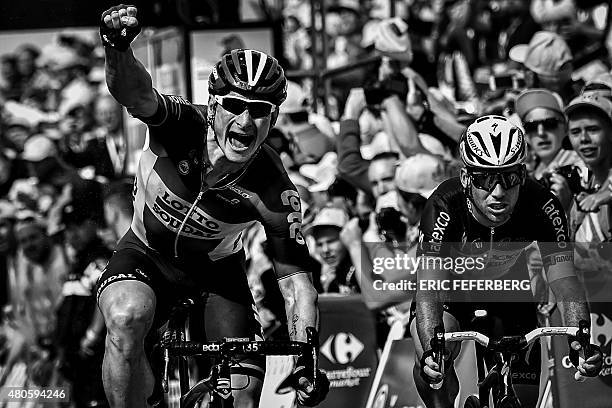 Germany's Andre Greipel celebrates as he crosses the finish line ahead of Great Britain's Mark Cavendish at the end of the 166 km second stage of the...